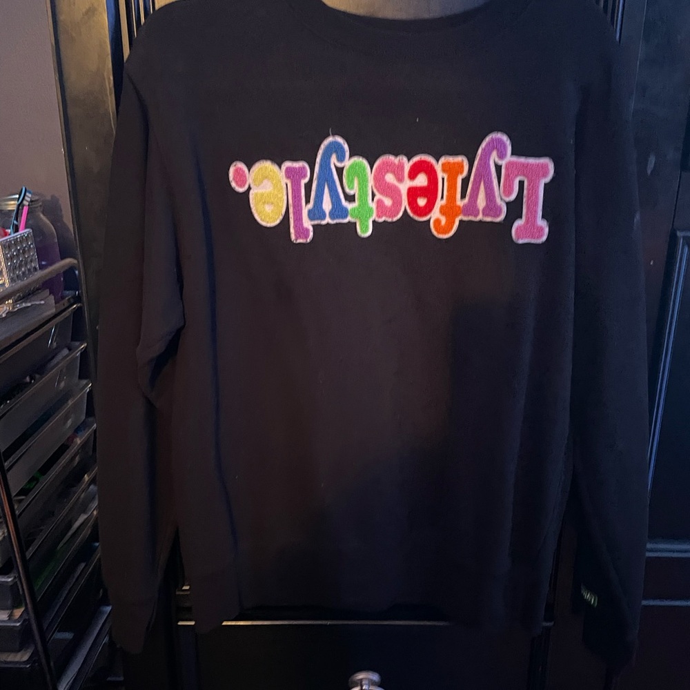 A black sweater with graphic
